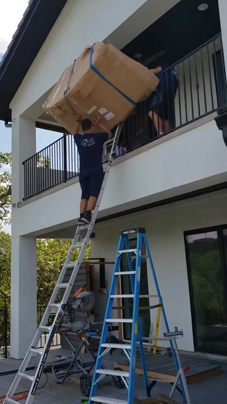Ford Moving crew handling a piece on a Portland job