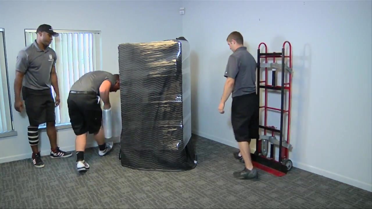 Ford Moving crew handling a piece on a Portland job